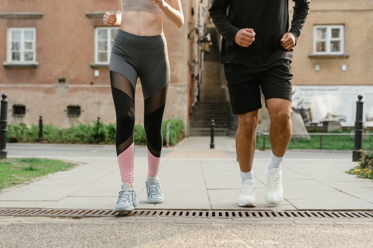 Two people enjoying a jog together outdoors